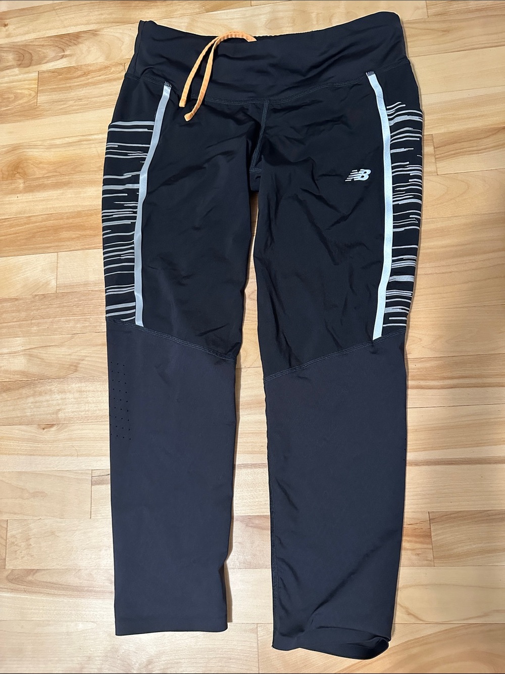 New Balance Cropped Black Leggings with Silver Side Panels and Orange Drawcord